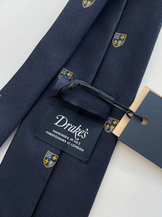 Drakes Navy Silk Tie with Crest Motif – A Touch of British Heritage
