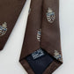 Drakes Salcombe Heraldic Silk Tie – Crowned Emblem in Chocolate Brown